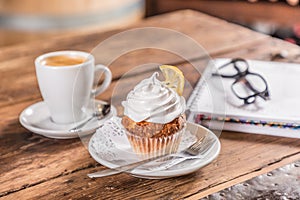 coffee with milk with cupcake note and glasses photo