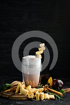 Coffee with milk and white chocolate. Cocoa. In the glass. Top view.