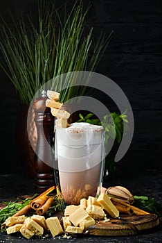 Coffee with milk and white chocolate. Cocoa. In the glass. Top view.