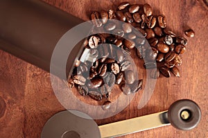 Coffee Mill and Coffee Beans on wooden cutting board