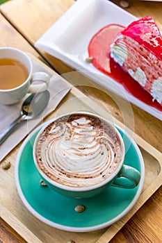 coffee mocha lattee cup on wood table and cake relax time on cafe shop