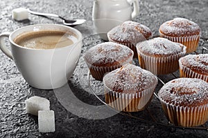 Coffee muffins on a wooden Board. Sweet muffins with berry filling on the table.