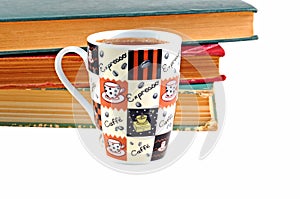 Coffee mug and books on white background