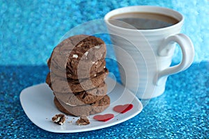 Coffee mug and cookies  blue background