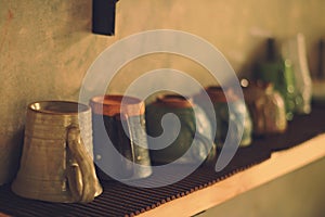 Coffee mug and glass on the shelf