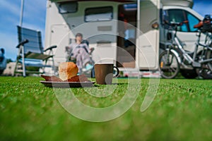 Coffee Mug on grass. Family vacation travel, holiday trip in mot