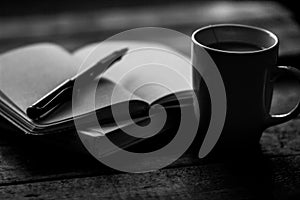 Coffee mug and journal in black and white