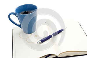 Coffee mug on notebook