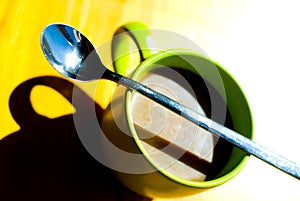 Coffee mug and spoon