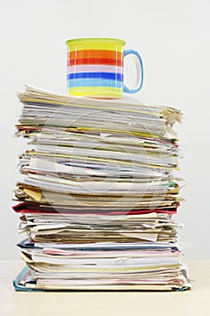 Coffee Mug On Stack Of Files
