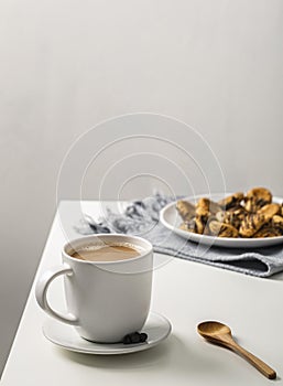 coffee mug table with plate cookies. High quality photo