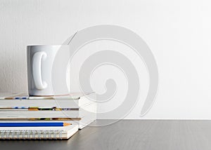 Coffee mug on writing working desk