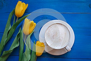 Coffee mug with yellow tulip flowers