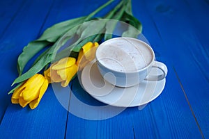 Coffee mug with yellow tulip flowers
