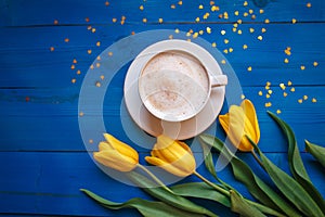 Coffee mug with yellow tulip flowers