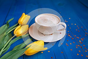 Coffee mug with yellow tulip flowers