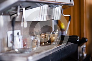 Coffee mugs on the coffee maker that have not been cleaned