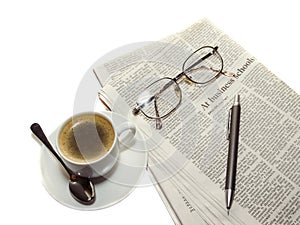 Coffee, the newspaper, pencil