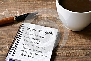Coffee and notepad with a list of September goals