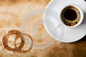Coffee on old paper with round coffee stains photo