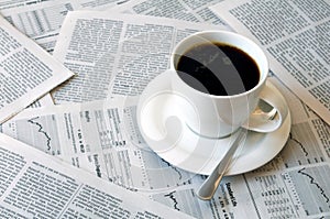 Coffee over newspaper