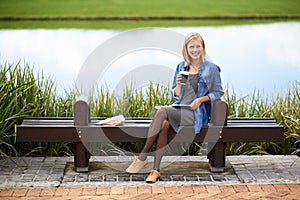 Coffee, park and portrait of woman on bench with newspaper for lunch break, relax and calm in nature. Happy, reading and