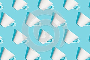 Coffee pattern of white cup for coffee on blue background.