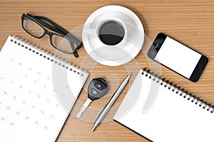 Coffee and phone with car key,eyeglasses,notepad,calendar