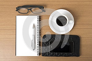 Coffee,phone,eyeglasses,notepad and wallet
