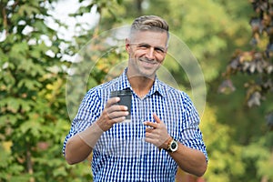 Coffee plantation owner. Man drinking coffee paper cup. One more sip of coffee. Drinking coffee on the go. Relax and