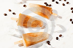 Coffee Popsicles, Refreshing Ice Lollies with Coffee Beans and Ice on Bright Background