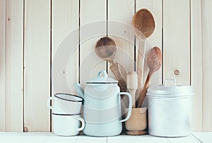 Coffee pot, enamel mugs and rustic spoons