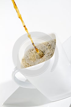 Coffee pouring on white
