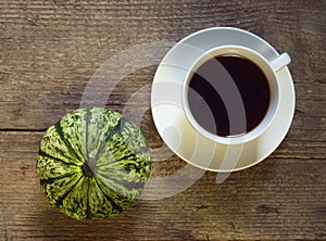 Coffee And Pumpkin On Wood