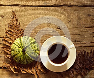 Coffee And Pumpkin On Wood