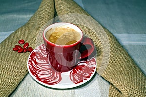 Coffee in a red colored ceramic coffee cup