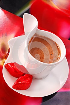 Coffee with red lips from chocolate