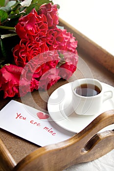 Coffee and red roses for beloved woman