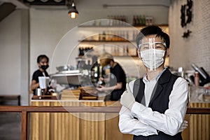 Coffee and restaurant shop owner expressed confidence in preventing COVID-19, or the coronavirus, by wearing a face mask and photo
