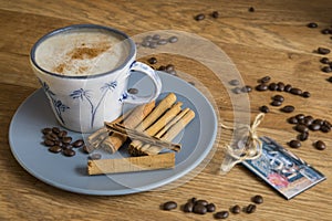 Coffee, roast beans and cinnamon sticks.