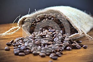 Coffee sack, with espresso coffee and an old blue grinder