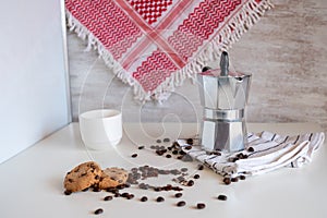 Coffee set of espresso boiler with grounded and beans of coffee on white background with arabick shmagh photo