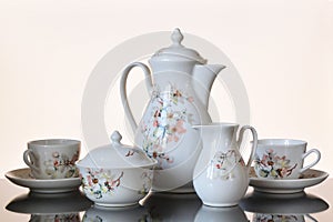 Coffee set on a glass table.