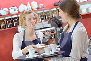 Coffee shop baristas working