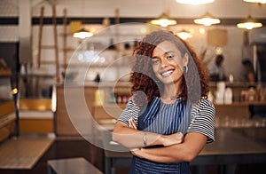 Coffee shop, happy barista and portrait of woman in cafe for service, working and crossed arms. Small business owner