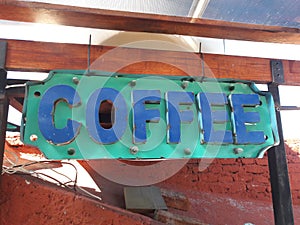 Coffee shop rustic metal blue and torquoise sign in small cafe in San Miguel de Allende mexico