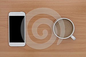 Coffee and smart phone on wooden table