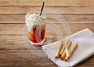 Coffee smoothie with wafers on vintage table