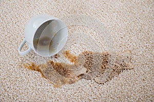 Coffee spilling on carpet photo