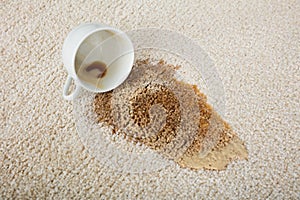 Coffee Spilling From Cup On Carpet